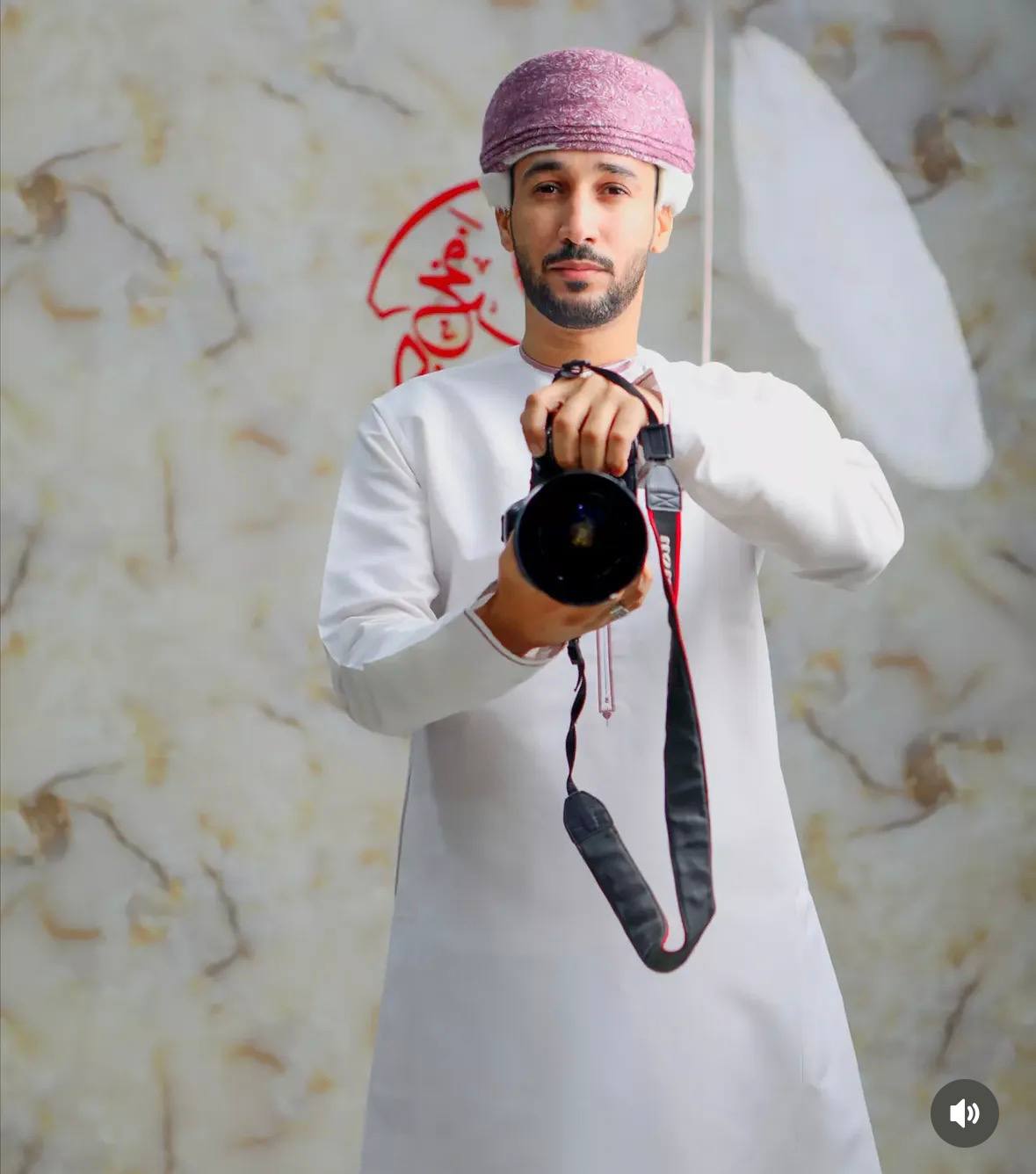 Ibrahim holding his camera